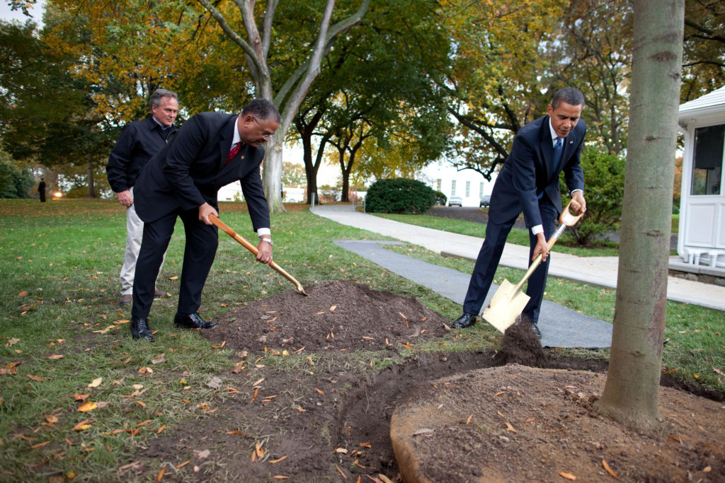 President Barack Obama, along with Grounds Superintendent Dale Haney and Chief Usher Rear Admiral Stephen W. Rochon (Ret.), participates in a commemorative tree planting ceremony on the North Grounds of the White House, Oct 28, 2009. (Official White House Photo by Chuck Kennedy) This official White House photograph is being made available only for publication by news organizations and/or for personal use printing by the subject(s) of the photograph. The photograph may not be manipulated in any way and may not be used in commercial or political materials, advertisements, emails, products, promotions that in any way suggests approval or endorsement of the President, the First Family, or the White House.