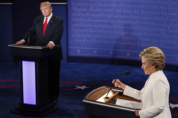 Republican U.S. presidential nominee Donald Trump listens as Democratic U.S. presidential nominee Hillary Clinton speaks during their third and final 2016 presidential campaign debate at UNLV in Las Vegas, Nevada, U.S., October 19, 2016.   REUTERS/Mark Ralston/Pool - RTX2PLUT