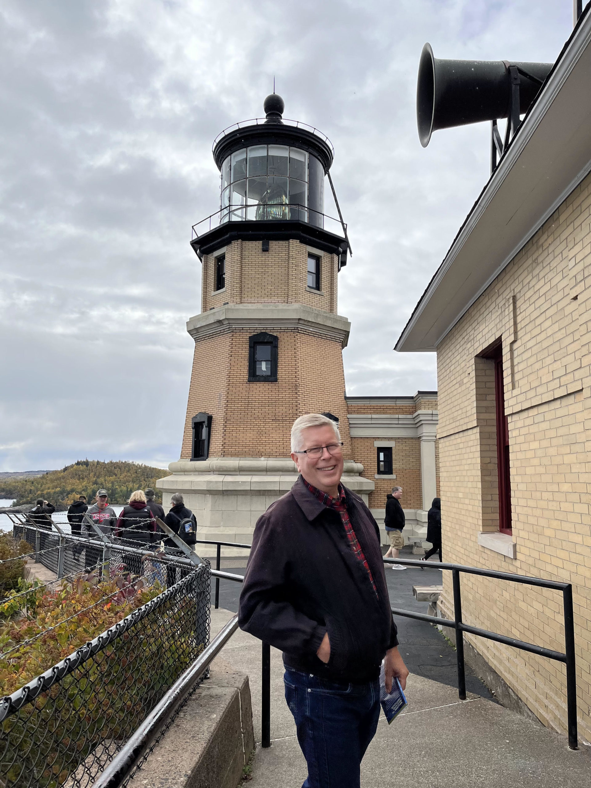 Photo Courtesy of Terry Davidson, pictured here in front of the Split Rock Lighthouse in Minnesota.